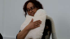 Carer with one of the Hug Buddies