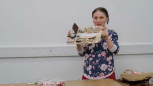Carer with one of the Activity Boards