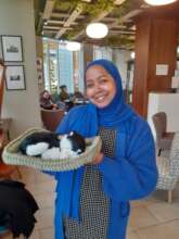 Carer Elham with a comfort pet she borrowed.