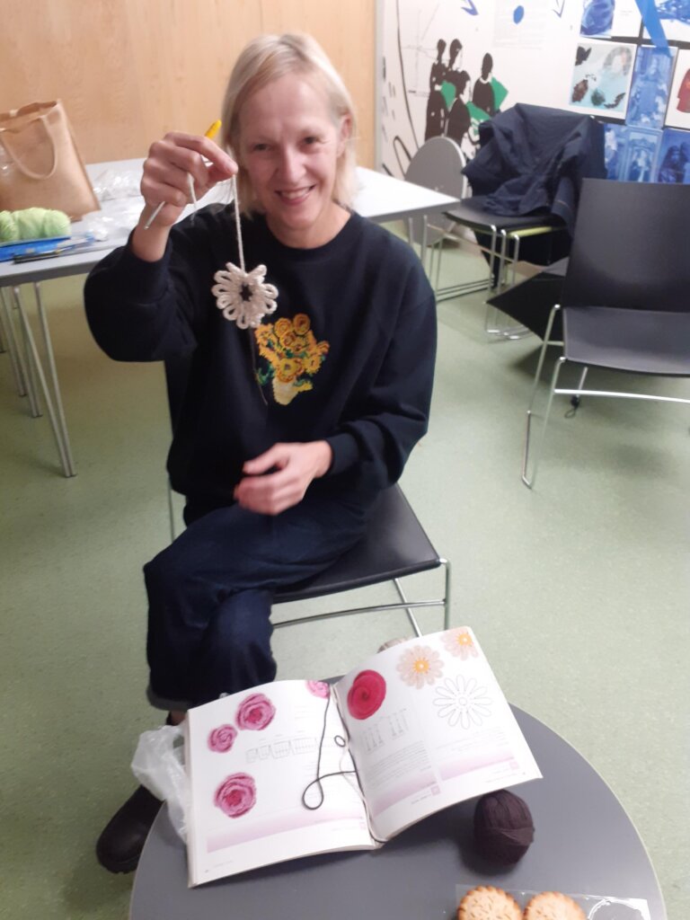 Carer Irina with her knitting at a coffee morning