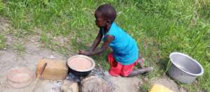Catherine cooking her porridge