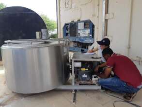 SVRG X OMASI team fixing the chillers