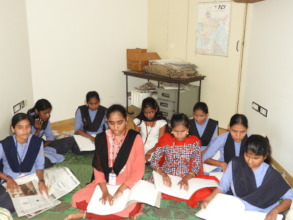 Girls studying using Braille Books