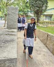 Jayashree walks confidently with her white cane