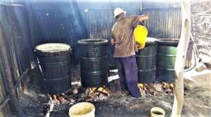 Brewing local gin (chang'aa), illegal but common