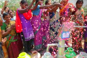 Villagers celebrating well