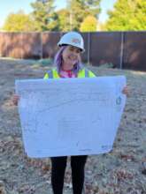 Program Manager Caitlyn Patterson with site plan