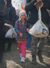 Next time I'll help momma carry the bag...