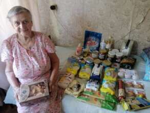 Grandma Galya with a grocery set from us