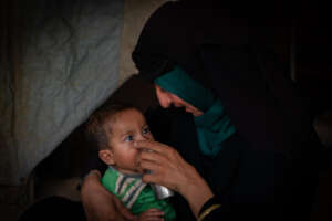 Samira* cares for son Abdalla* in Syria