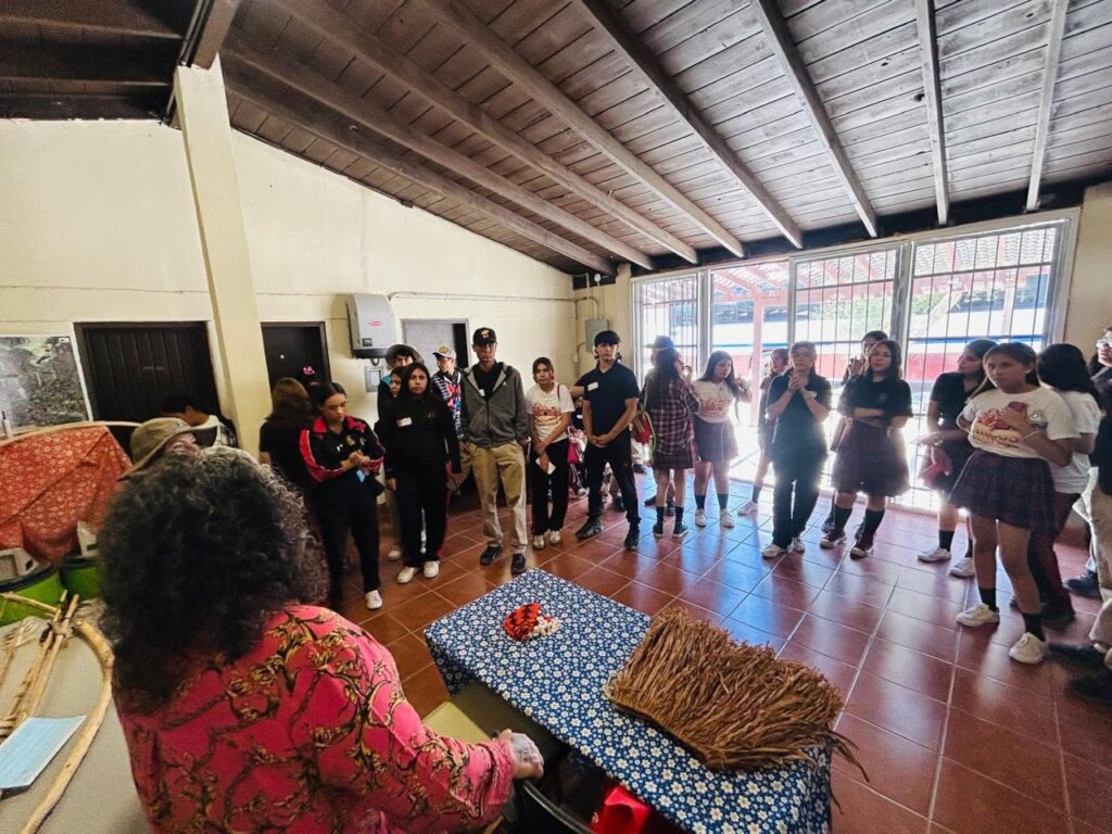 Cultural promoter explains traditional clothing.