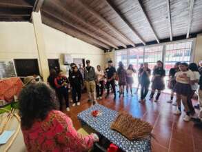 Cultural promoter explains traditional clothing.