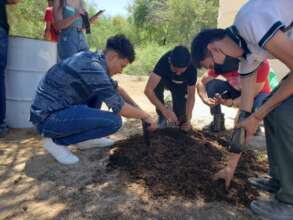 Students filling nursery bags for plant production