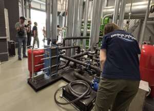 (Peace Winds staff inspect water facilities)