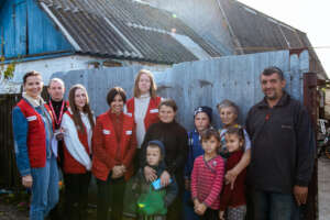 Save the Children staff with a family in Kyiv.