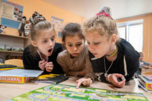 Girls playing a mine safety awareness game.