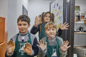 Children pose after an art therapy session.