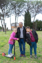 Oleksandr with his two grandchildren.