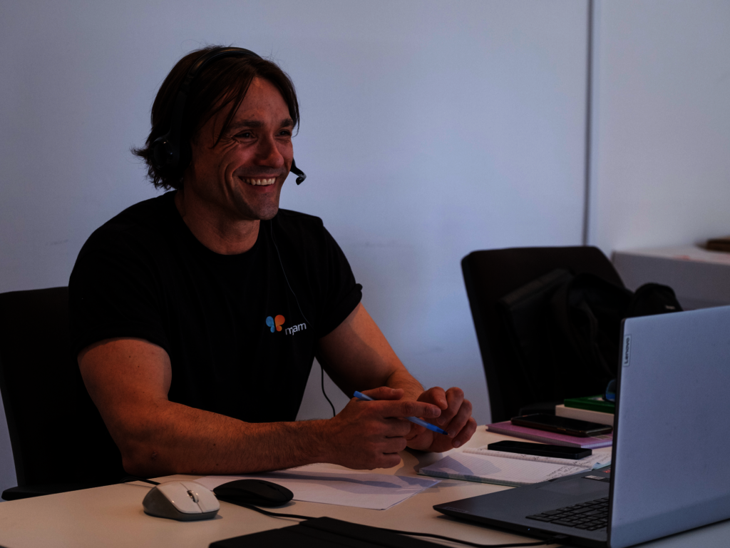 Roman taking a call at the Migam office in Poland.