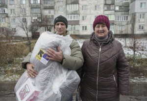 Valentyna and Alexander receiving winter kits