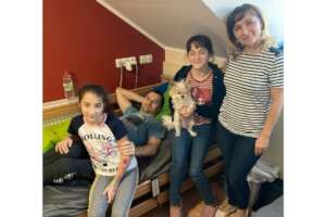 Olesia, Ivan, Dasza and Maryna in the hostel room.