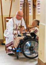 PAY IT FORWARD - Mykhailo with a local priest