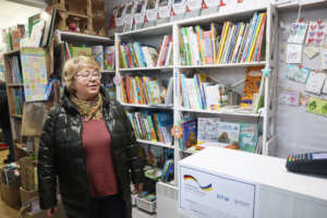 Iryna in her bookshop. Photo: IOM/Alisa Kyrpychova