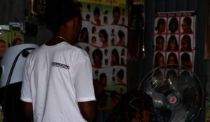 Mekdes plaiting hair in her salon