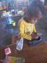 Mackenzie exploring some vocabulary objects