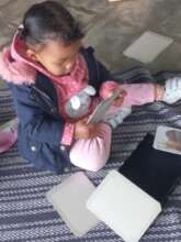 A 1 year old looking at vocabualry cards