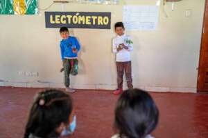 Children holding their plants after a learning act