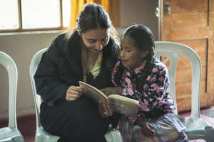 Embassy representative reading with a student