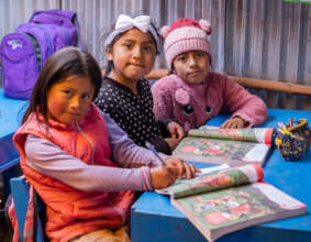 Children with their books at the mobile library