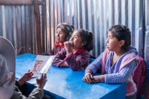 Handing out the books to the children