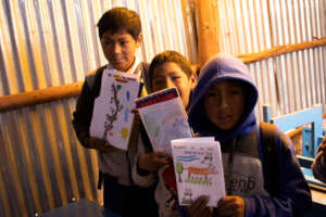Kids showing off their art