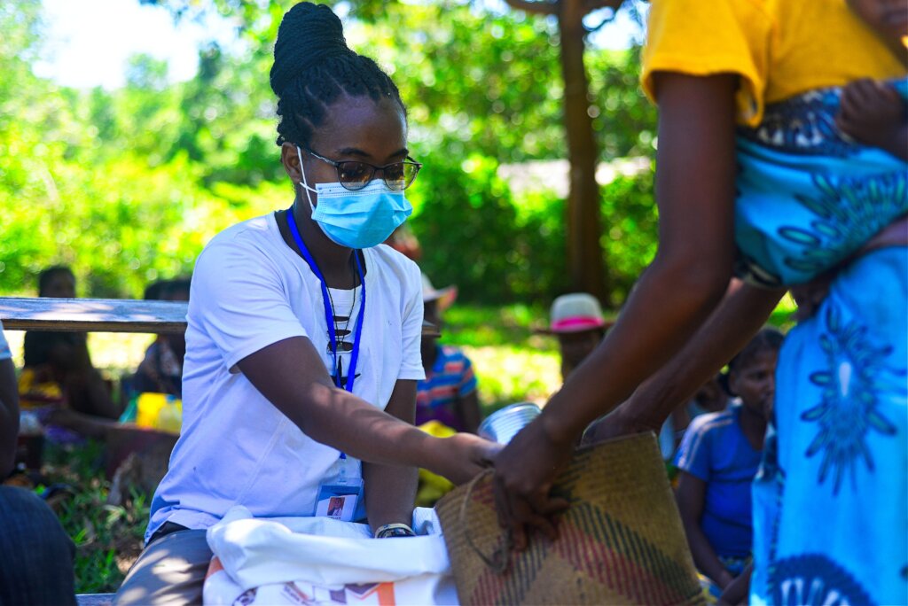 Midwife Robline delivering food after cyclone