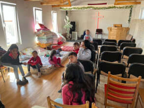 Romani people taking refuge in a small church