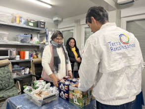 Handing over supplies to facility staff