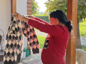 Refugee receiving winter clothes