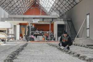Tatiana checking screed guides before the pour