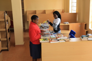 Staff sort through books for the new library