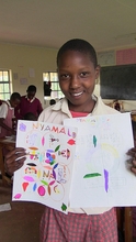 Proudly displaying her artwork