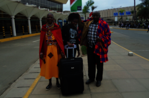 With her proud parents at the airport