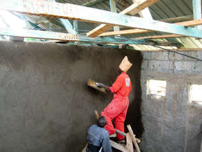 plastering the dorm walls