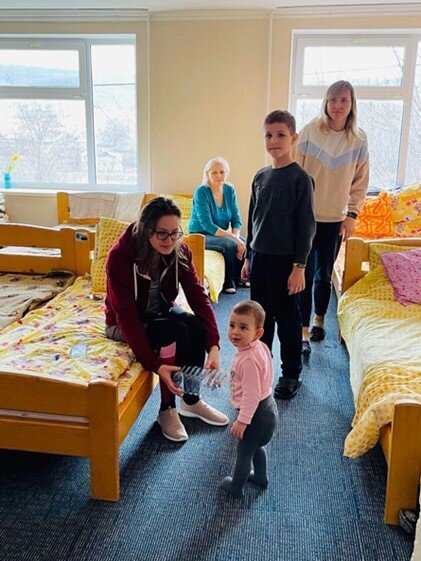 Ukrainian family in a make-shift reception center