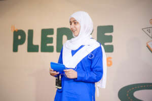 Eman presenting her project at The Pledge