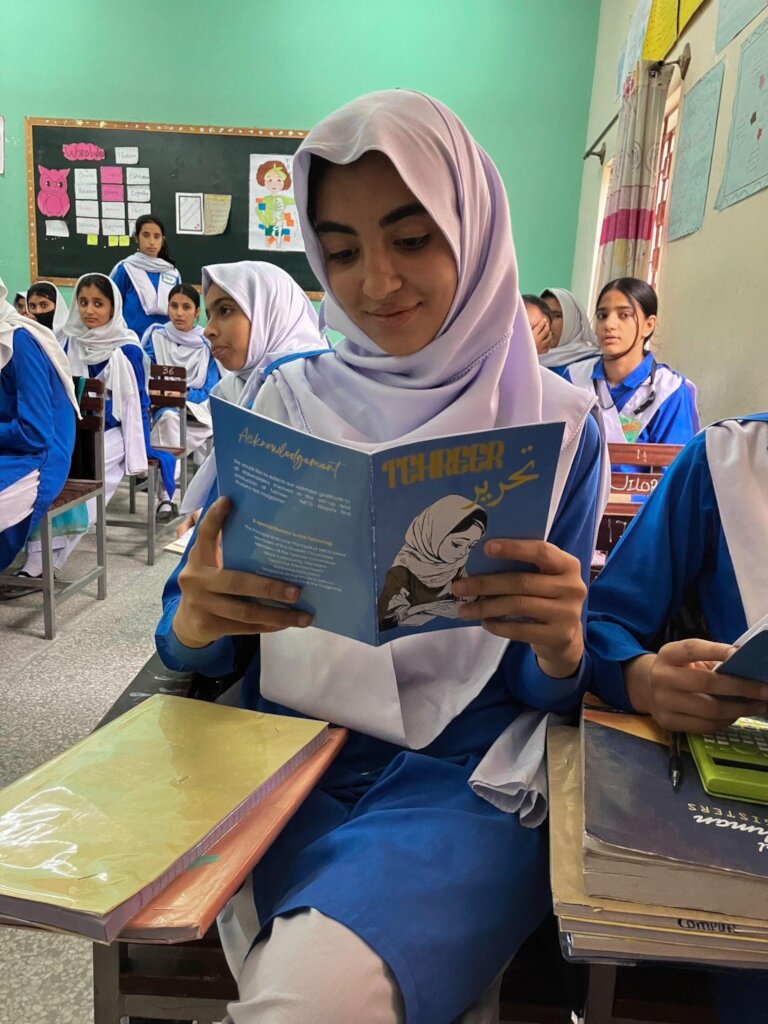 Hira seeing her story printed for the first time