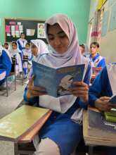Hira seeing her story printed for the first time