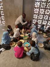 Children enjoying the feeding program