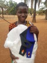 Kamawornie student receiving a bed net